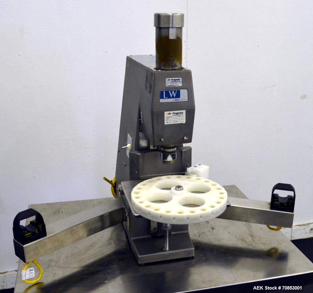 https://ww2.aaronequipment.com/Images/ItemImages/Packaging-Equipment/Cappers-Pharmaceutical-Crimp/West-LW_70853001_a.jpg