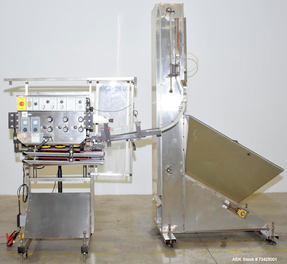 https://ww2.aaronequipment.com/Images/ItemImages/Packaging-Equipment/Cappers-Quill-Automatic-Inline/E-Pak-Machinery-3-Spindle_73425001_aa.jpg