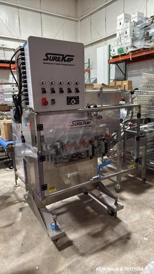 https://ww2.aaronequipment.com/Images/ItemImages/Packaging-Equipment/Cappers-Quill-Automatic-Inline/Surekap-SK8000-BF6-70_70171004_aa.jpg